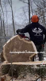 Model wearing Lumberjack hoodie in forest background